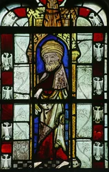 Figure with Unusual Headgear and Heraldic Eagles